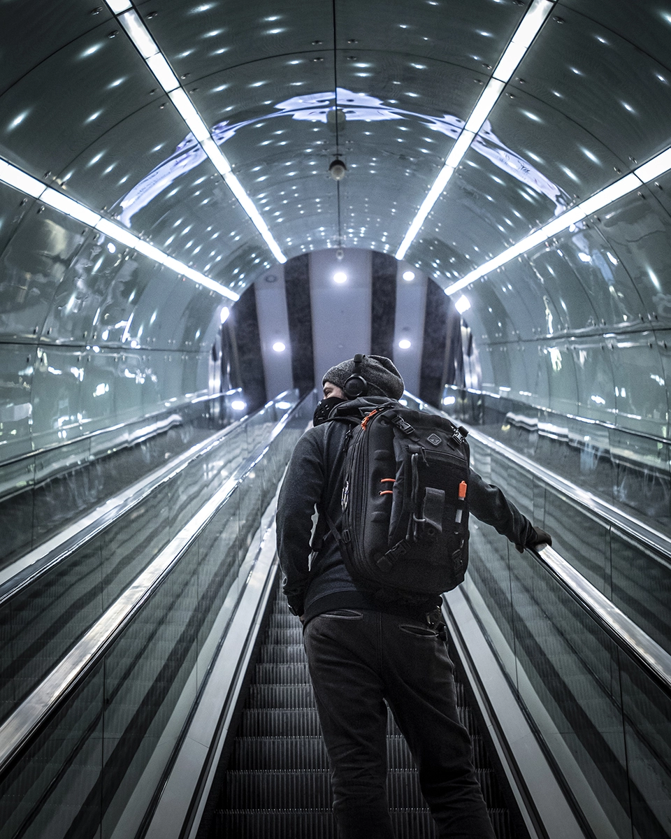 commercial-lifestyle-photography-subway-escalator-citylights-hardshell-backpack